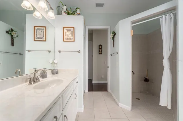 a bedroom with furniture and a flat screen tv