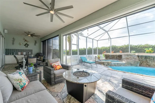 a view of a backyard with table and chairs potted plants