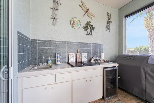 a view of a house with backyard and porch