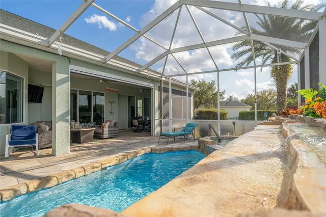 a view of a swimming pool with a yard