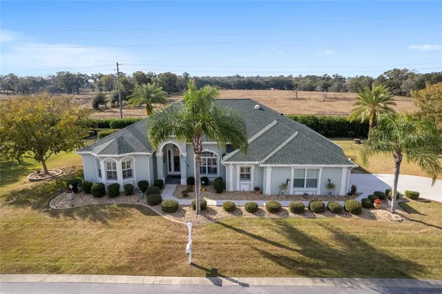 a aerial view of a house with a big yard