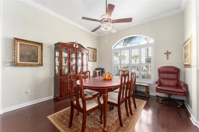 a living room with furniture a flat screen tv and a large window