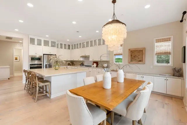 a kitchen with a table and chairs in it
