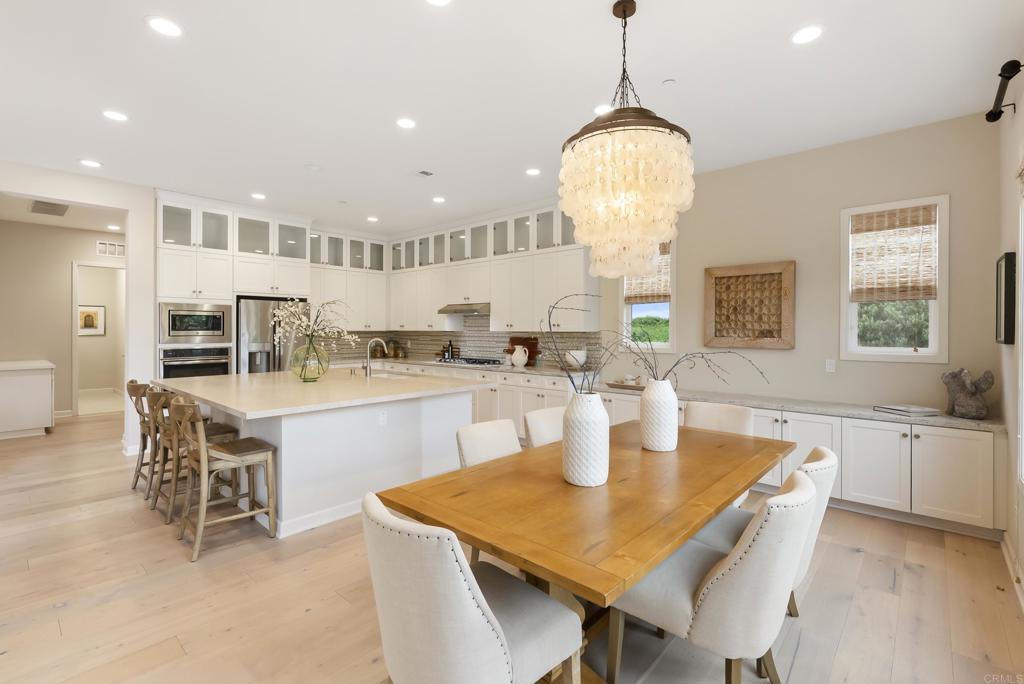 1352 Baumgartner Way Escondido, CA 92026 - Photo 13 of 47 a kitchen with a table and chairs in it
