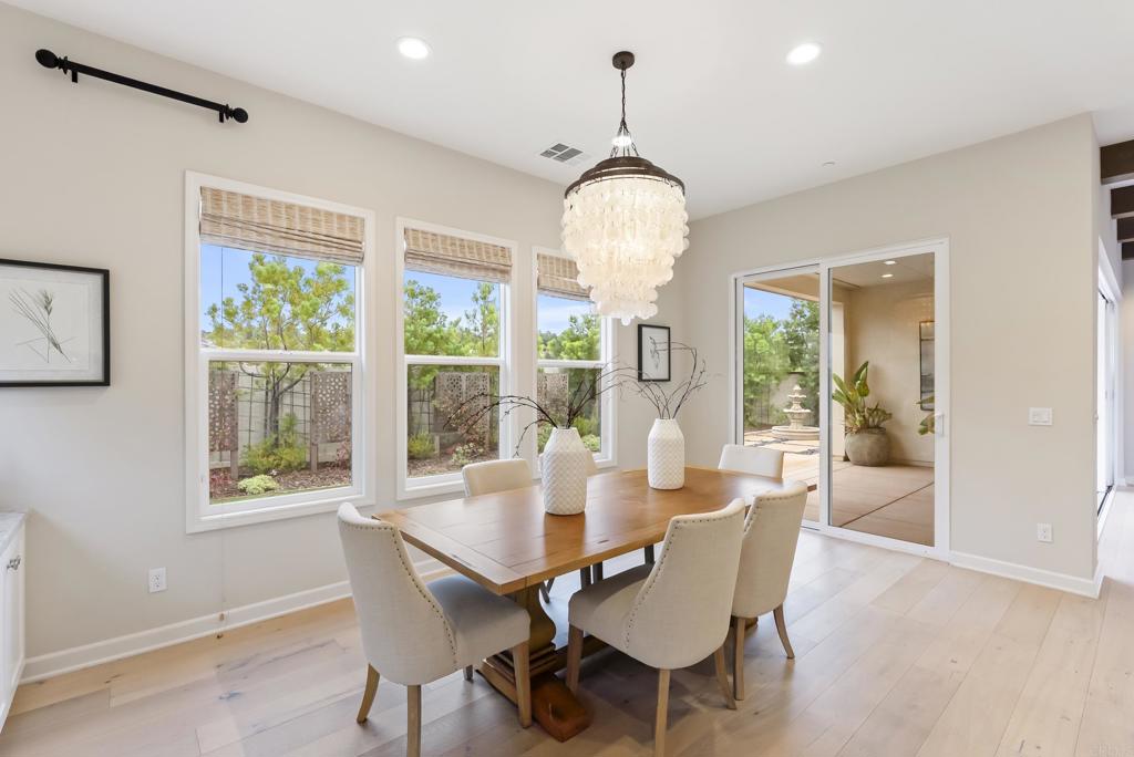 1352 Baumgartner Way Escondido, CA 92026 - Photo 18 of 47 a view of a dining room with furniture wooden floor and chandelier