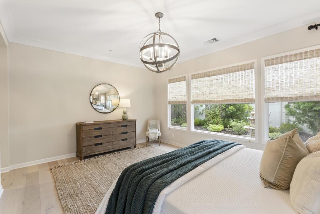 1352 Baumgartner Way Escondido, CA 92026 - Photo 24 of 47 a bed room with a bed mirror and window