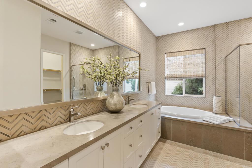 1352 Baumgartner Way Escondido, CA 92026 - Photo 25 of 47 a spacious bathroom with a granite countertop tub sink and mirror