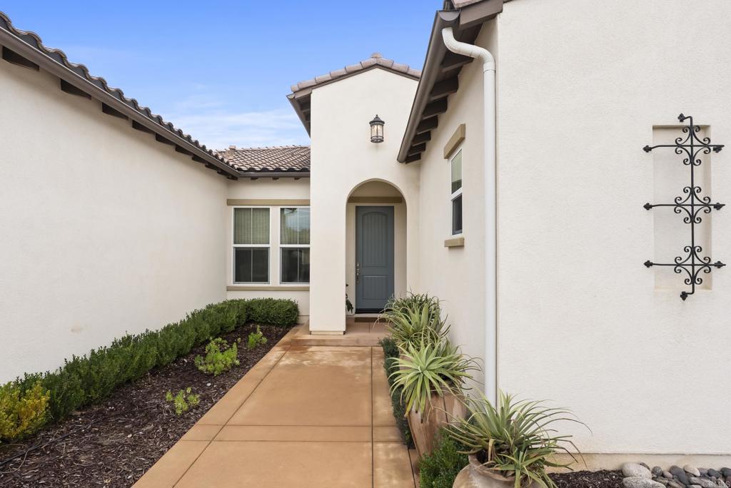 1352 Baumgartner Way Escondido, CA 92026 - Photo 3 of 47 a front view of a house with garden