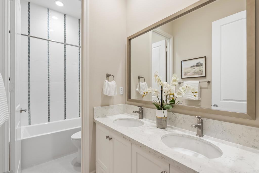 1352 Baumgartner Way Escondido, CA 92026 - Photo 33 of 47 a bathroom with a double vanity sink and mirror