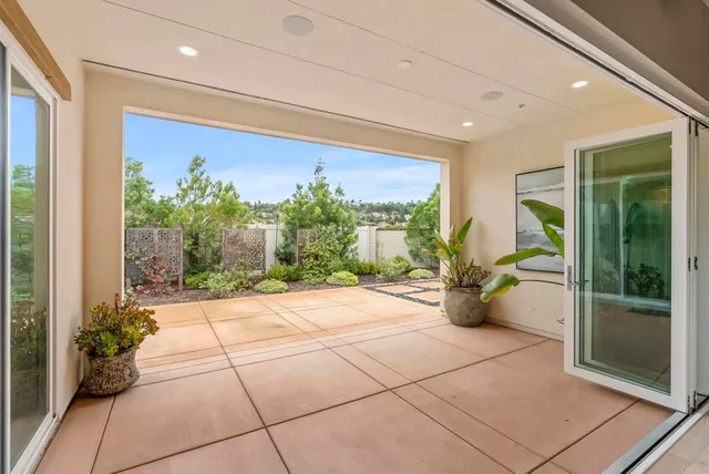 a lobby with furniture and floor to ceiling window