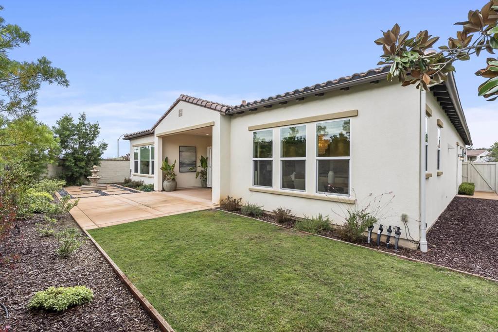 1352 Baumgartner Way Escondido, CA 92026 - Photo 40 of 47 a front view of a house with a yard
