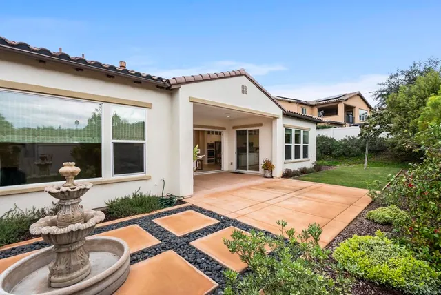 a view of a backyard with garden