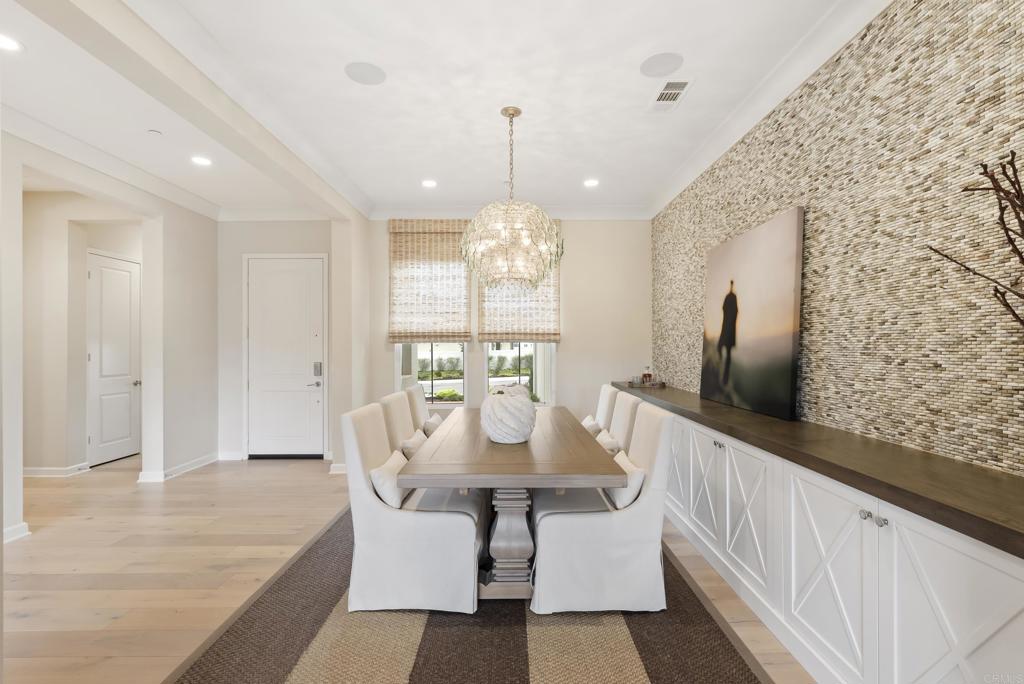 1352 Baumgartner Way Escondido, CA 92026 - Photo 7 of 47 a view of a dining room with furniture window and wooden floor