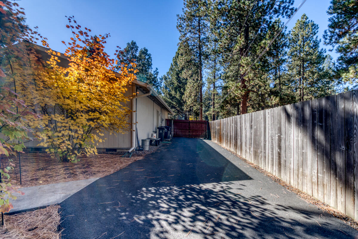 60452 Zuni Road Bend, OR 97702 - Photo 27 of 41 Paved drive way inside the gate to the Shop along the house and chicken coop
