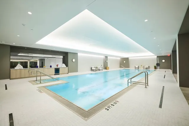 a view of a living room and kitchen