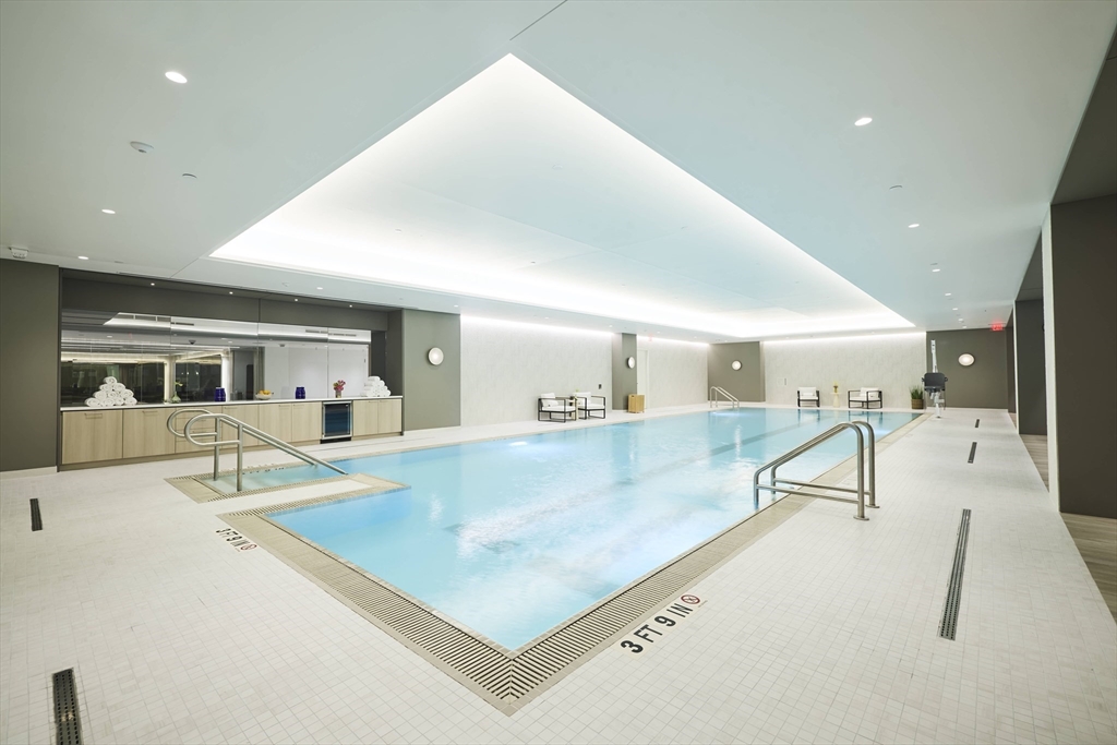 10 Rowes Wharf, Unit 1003 Boston, MA 02110 - Photo 16 of 25 a view of a living room and kitchen