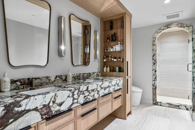 a bathroom with a double vanity sink mirror and double
