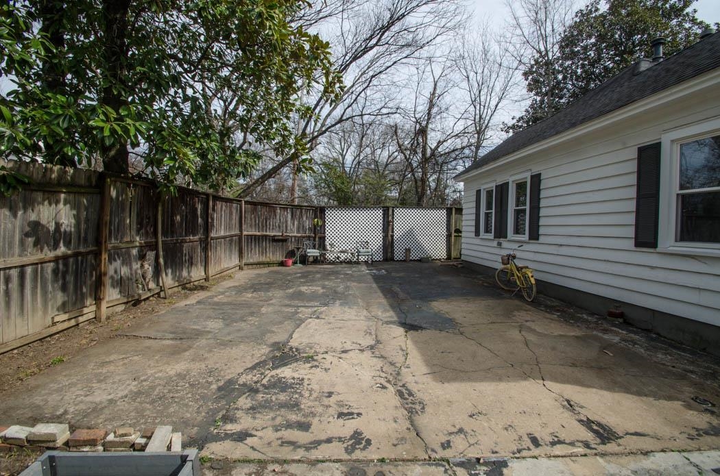 4572 Princeton Road Memphis, TN 38117 - Photo 18 of 24 a view of a backyard with large trees and a barn