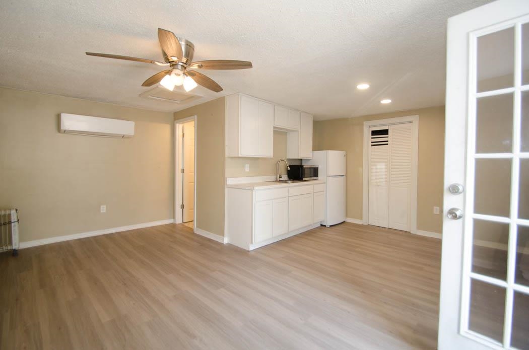4572 Princeton Road Memphis, TN 38117 - Photo 21 of 24 Kitchen with white cabinetry, light countertops, recessed lighting, light wood-style floors, and ceiling fan