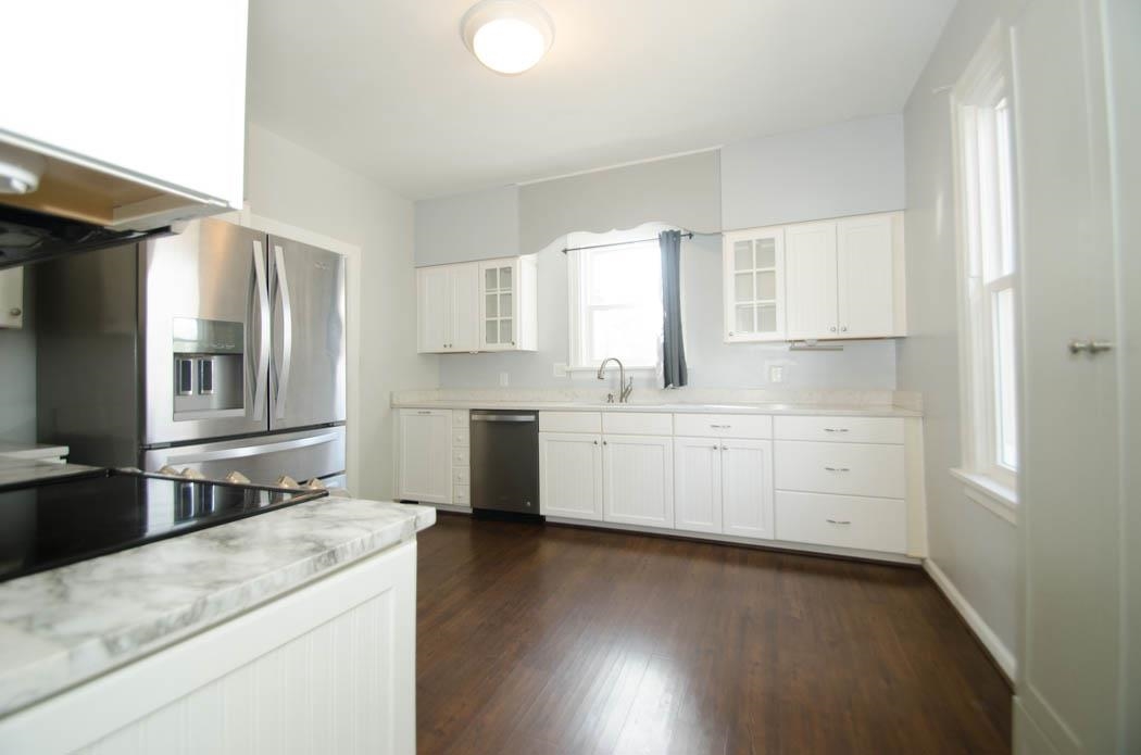 4572 Princeton Road Memphis, TN 38117 - Photo 10 of 24 a kitchen with cabinets appliances a sink and a window