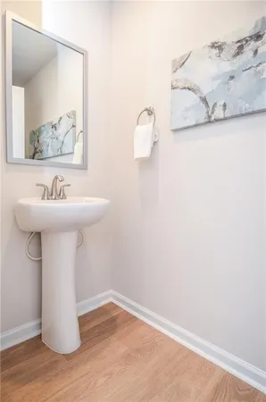 a bathroom with a sink and mirror