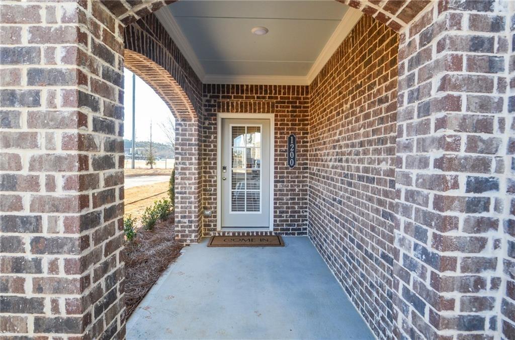 4553 High Rdg Court Sugar Hill, GA 30518 - Photo 2 of 39 a view of a brick buildings with entryway