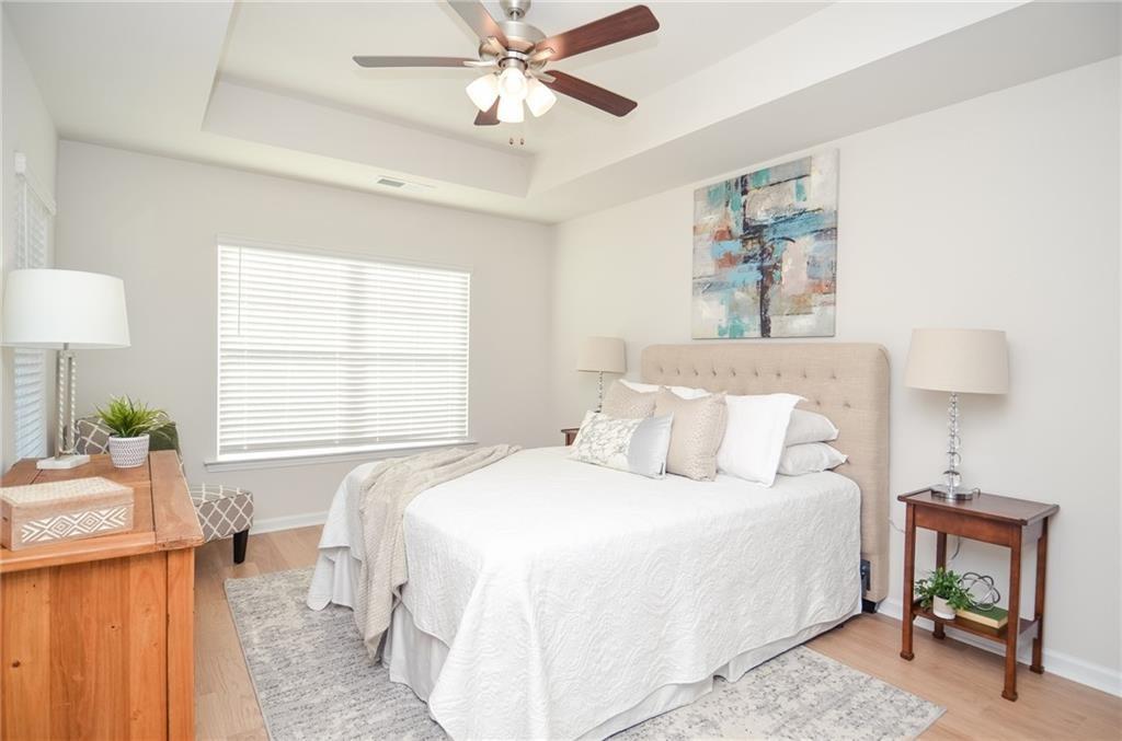 4553 High Rdg Court Sugar Hill, GA 30518 - Photo 22 of 39 a bedroom with a bed and a window