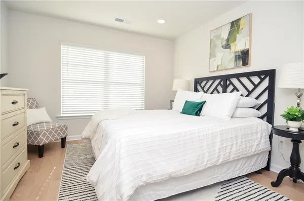a bedroom with a bed and window