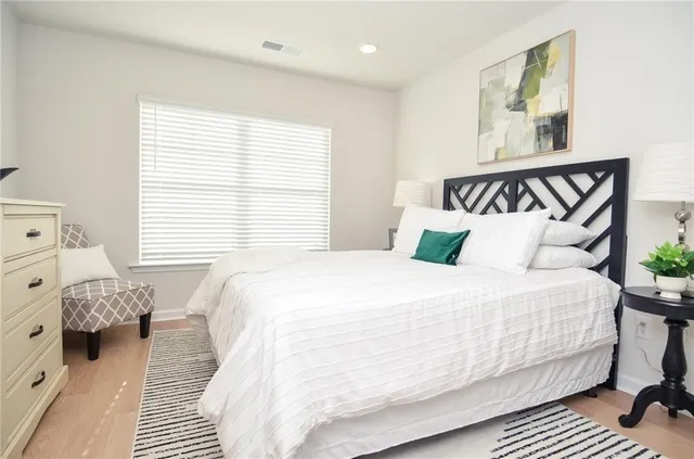 a bedroom with a bed and window