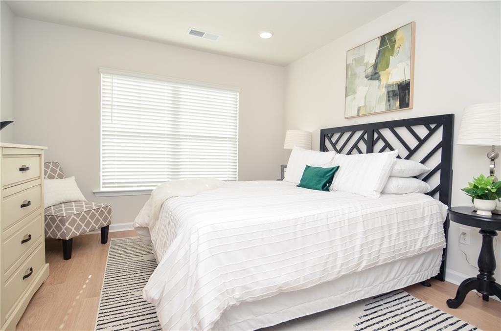 4553 High Rdg Court Sugar Hill, GA 30518 - Photo 29 of 39 a bedroom with a bed and window