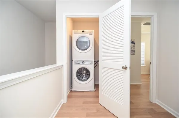 a view of a hallway with washer and dryer