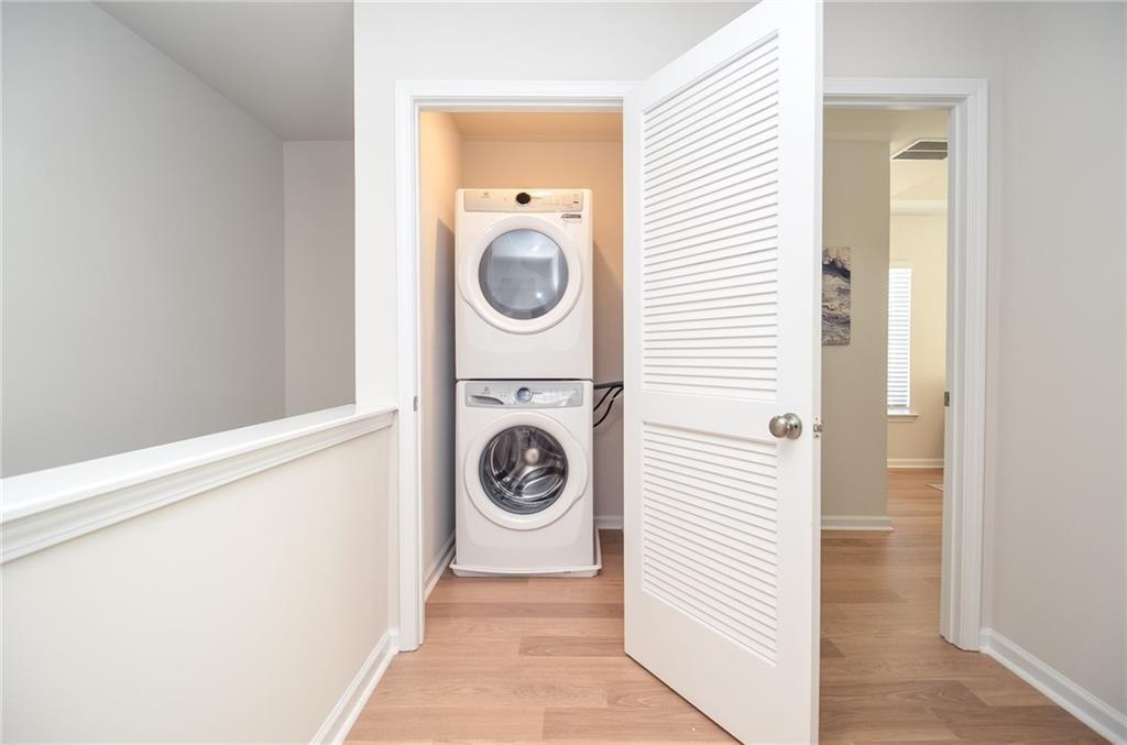 4553 High Rdg Court Sugar Hill, GA 30518 - Photo 32 of 39 a view of a hallway with washer and dryer