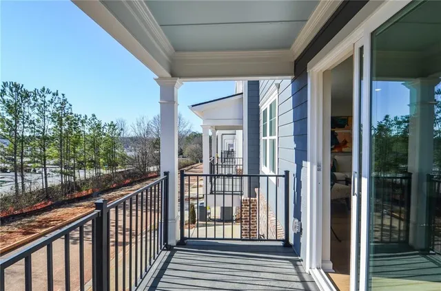 a view of a balcony with wooden floor
