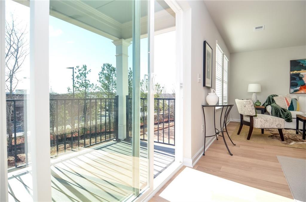 4553 High Rdg Court Sugar Hill, GA 30518 - Photo 34 of 39 a view of a room with wooden floor and windows