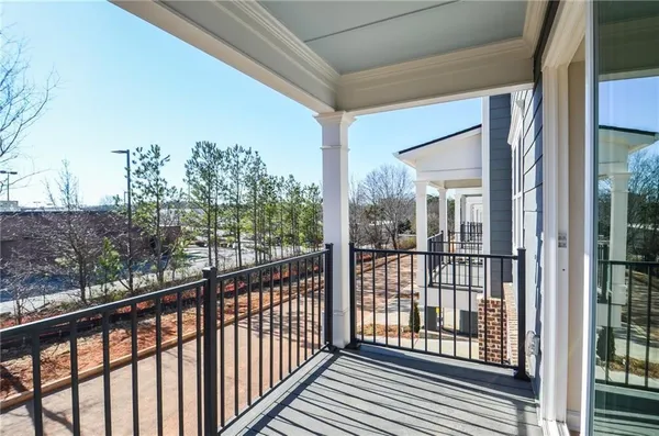 a view of a balcony with wooden floor
