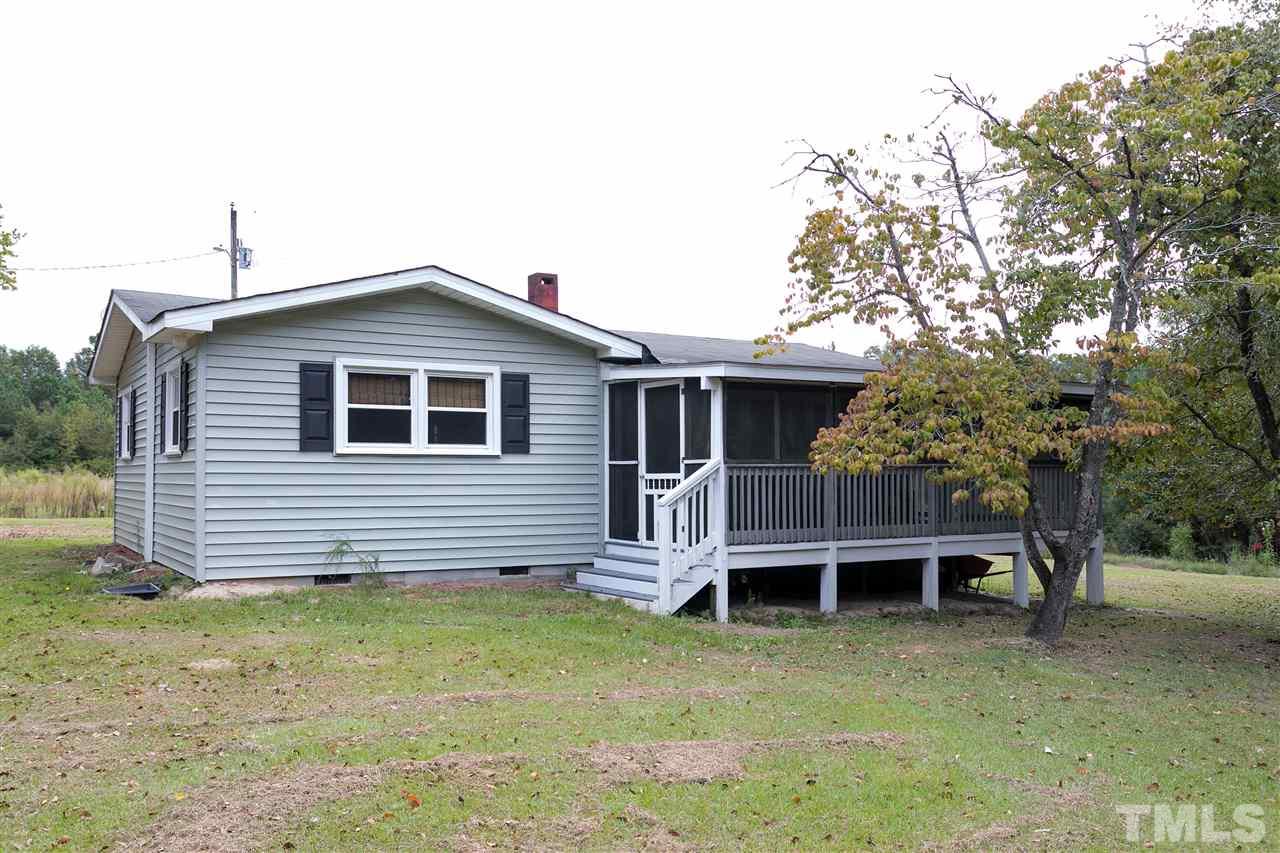 3315 Zacks Mill Road, Unit C Angier, NC 27501 - Photo 1 of 25 a front view of a house with a garden