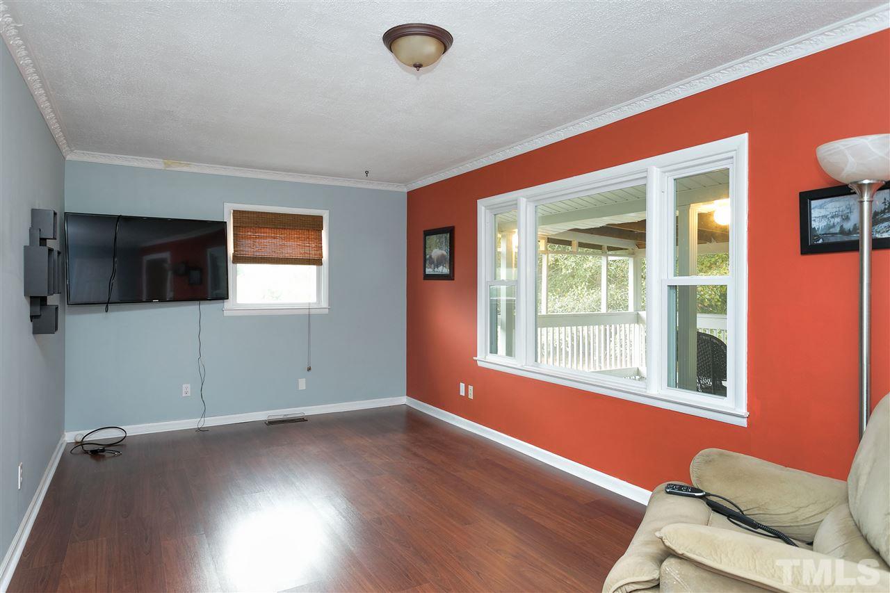 3315 Zacks Mill Road, Unit C Angier, NC 27501 - Photo 2 of 25 a view of empty room with wooden floor and fan