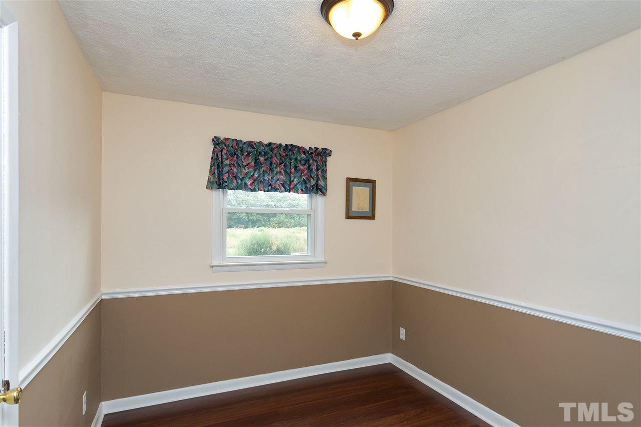 3315 Zacks Mill Road, Unit C Angier, NC 27501 - Photo 13 of 25 a view of room with window and wooden floor