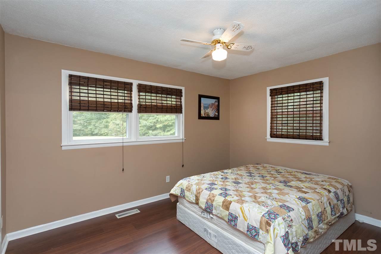 3315 Zacks Mill Road, Unit C Angier, NC 27501 - Photo 15 of 25 a bedroom with a bed and a window