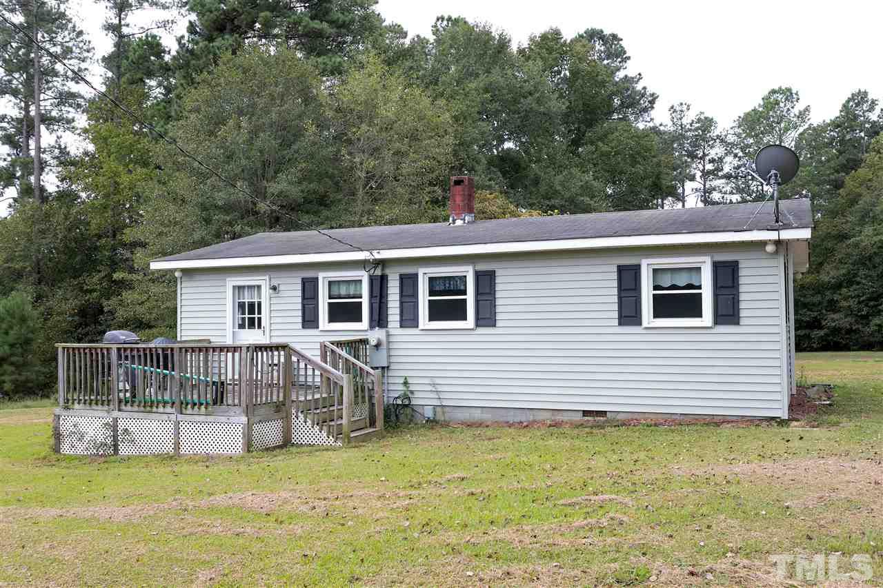 3315 Zacks Mill Road, Unit C Angier, NC 27501 - Photo 16 of 25 a view of a house with backyard and a tree