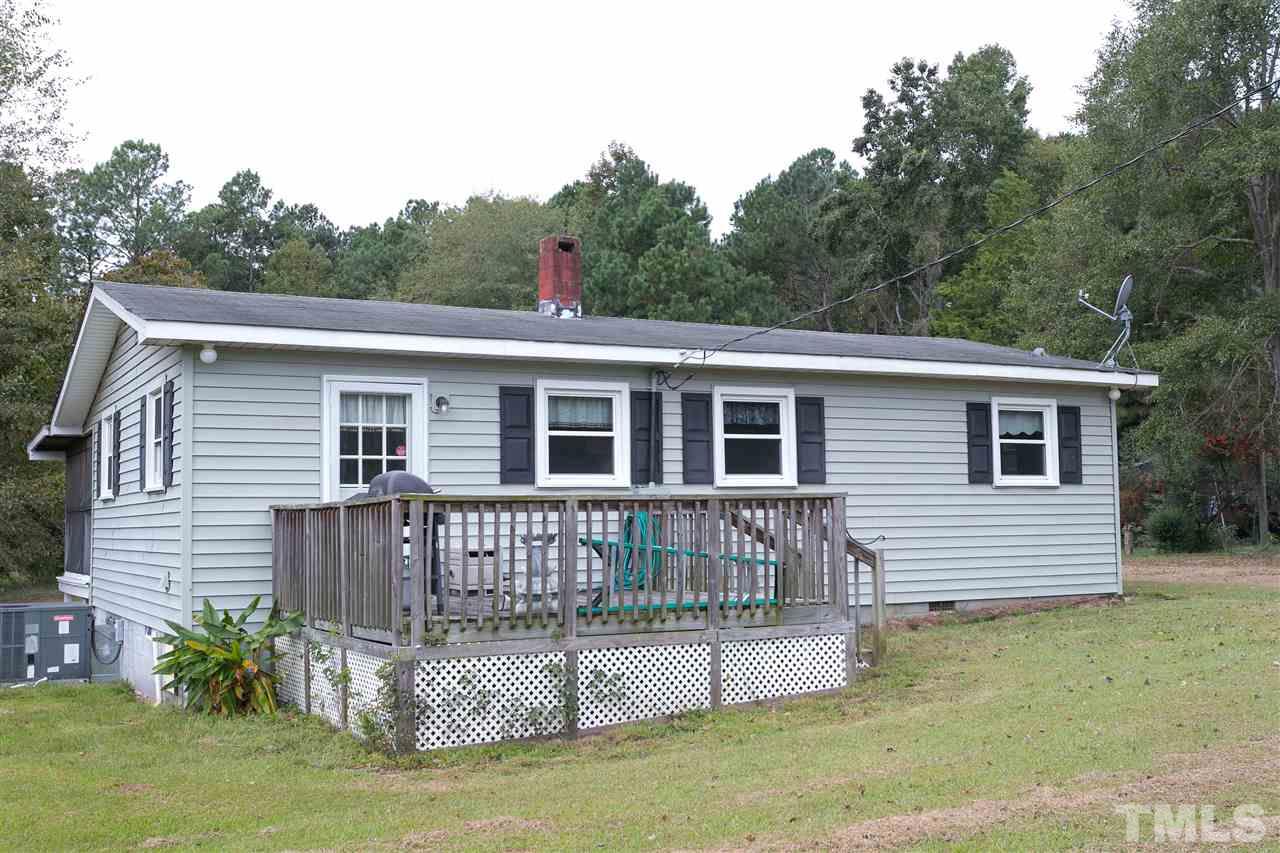 3315 Zacks Mill Road, Unit C Angier, NC 27501 - Photo 17 of 25 a view of a house with a roof deck