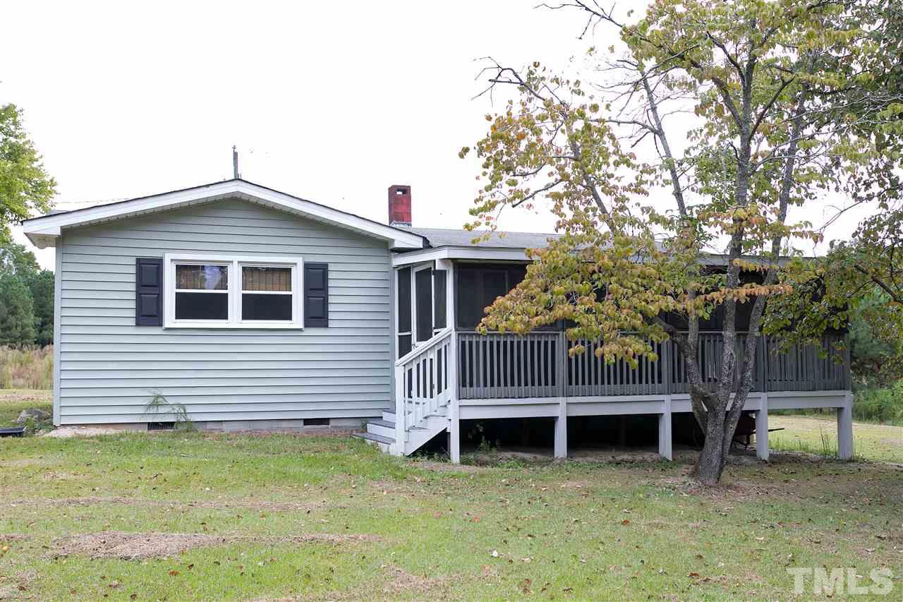 3315 Zacks Mill Road, Unit C Angier, NC 27501 - Photo 18 of 25 a view of a house with a yard