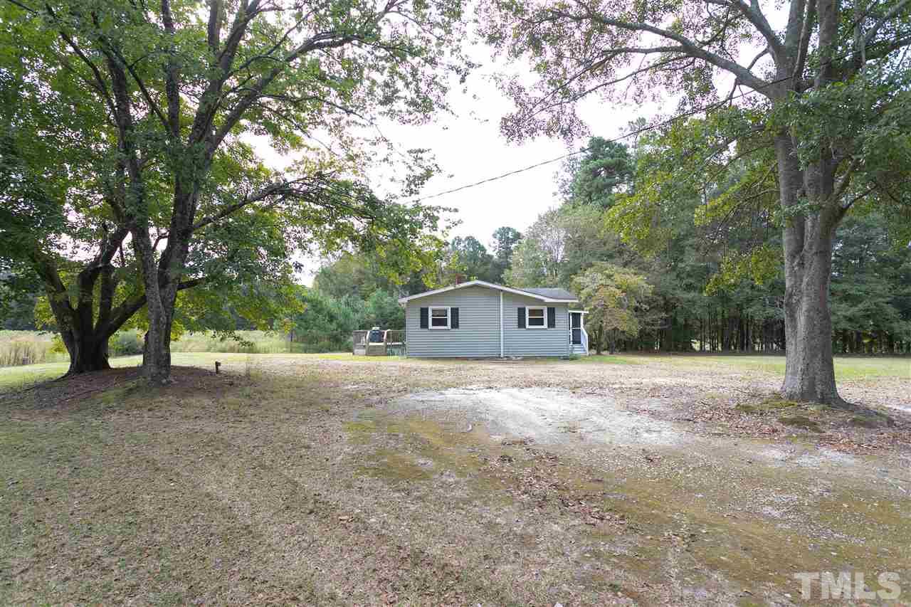 3315 Zacks Mill Road, Unit C Angier, NC 27501 - Photo 24 of 25 a house with trees in front of it