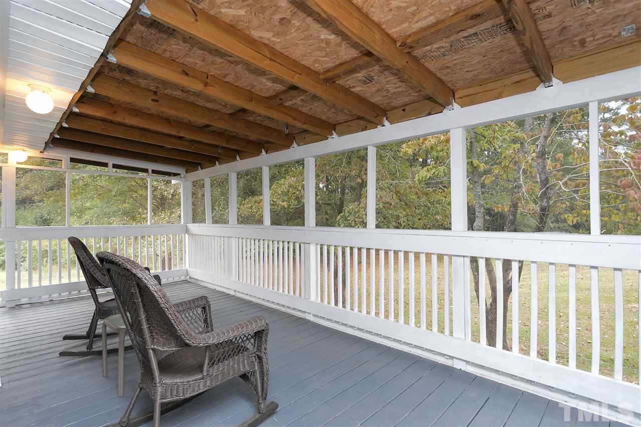 3315 Zacks Mill Road, Unit C Angier, NC 27501 - Photo 5 of 25 a view of a chair and table in the balcony