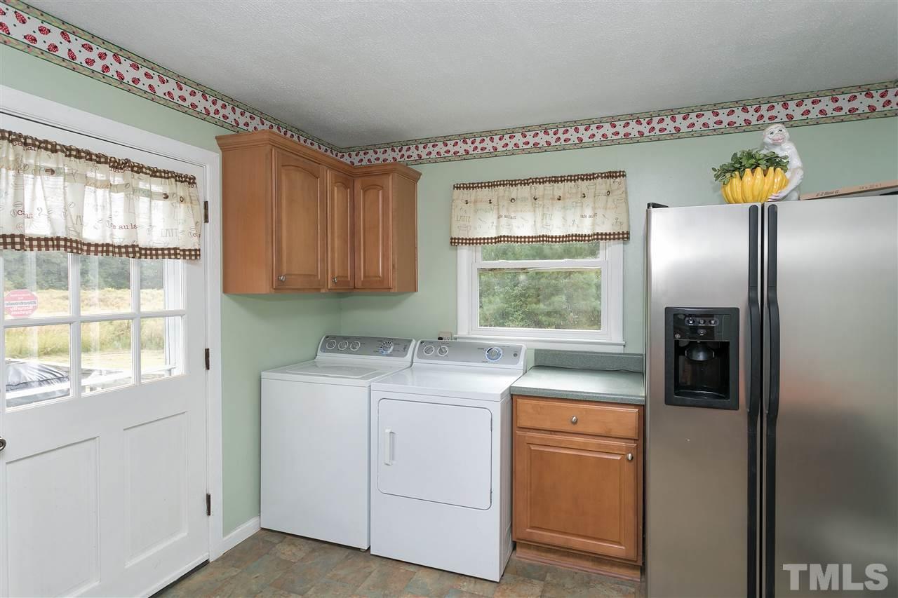 3315 Zacks Mill Road, Unit C Angier, NC 27501 - Photo 10 of 25 a kitchen with a window a washer and dryer