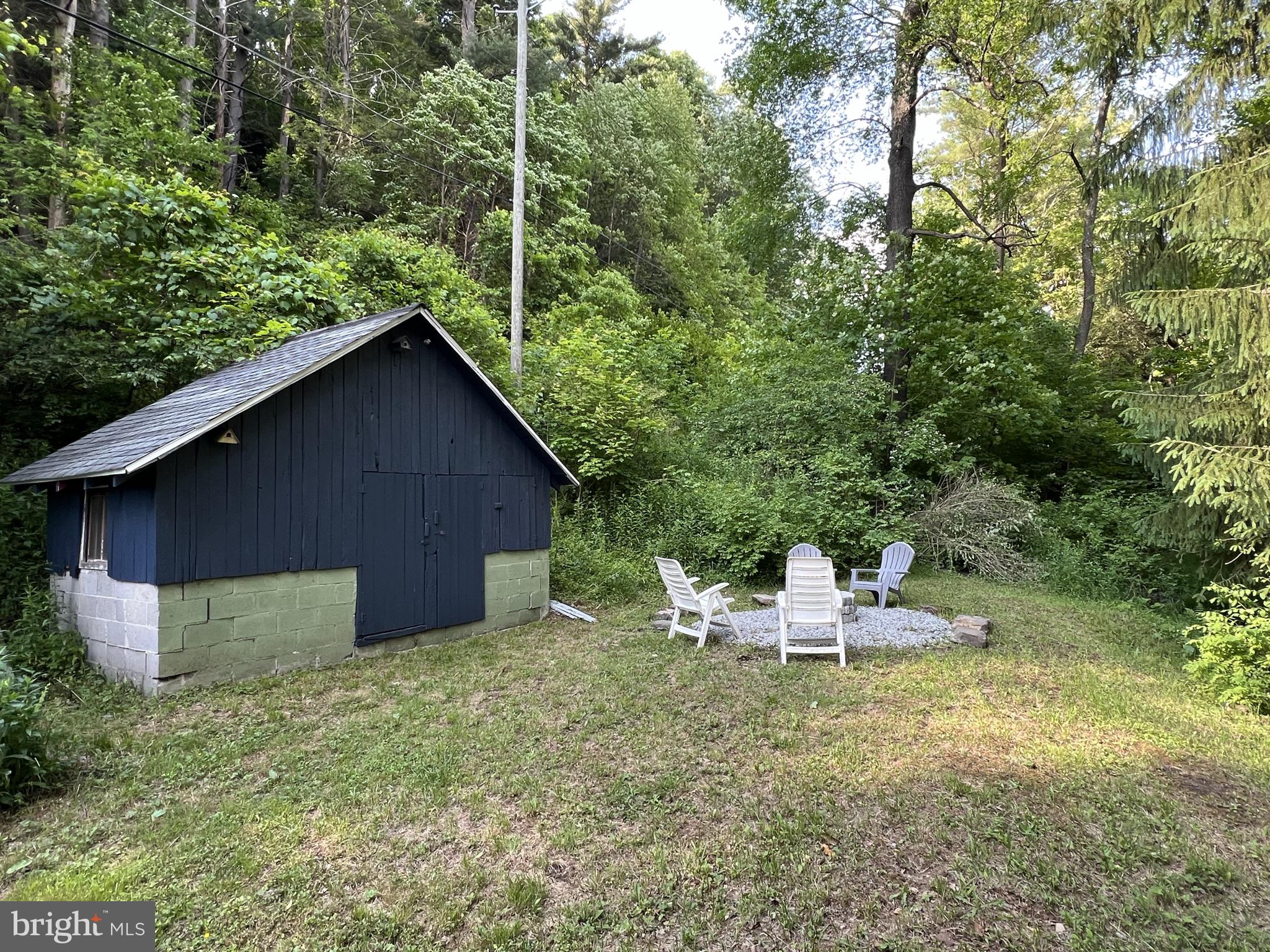 193 Gravelly Run Road McHenry, MD 21541 - Photo 13 of 57 a backyard of a house with table and chairs