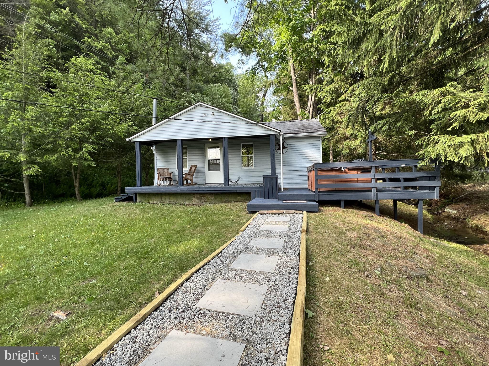193 Gravelly Run Road McHenry, MD 21541 - Photo 15 of 57 a front view of a house with a yard