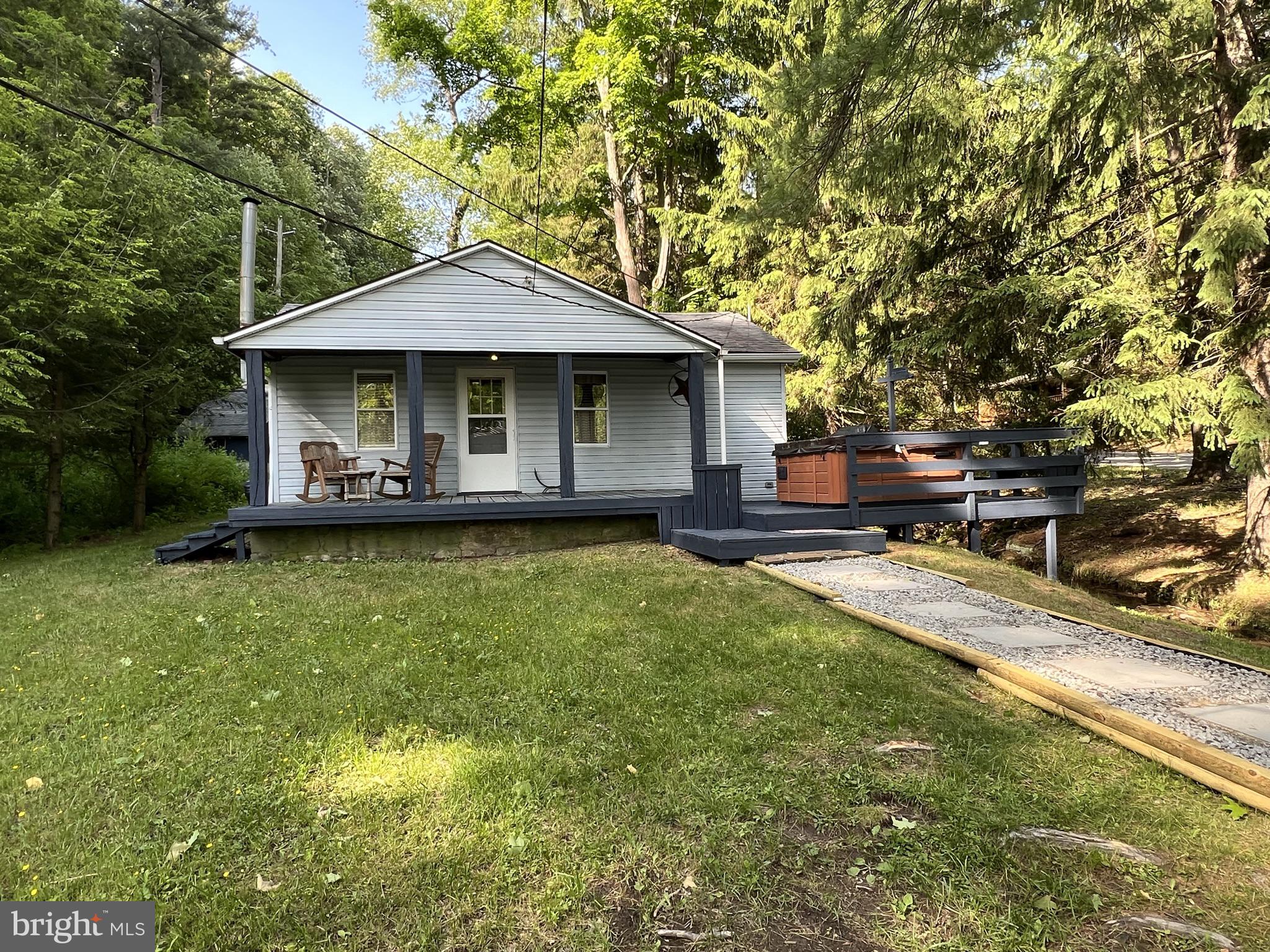 193 Gravelly Run Road McHenry, MD 21541 - Photo 16 of 57 a front view of a house with a yard