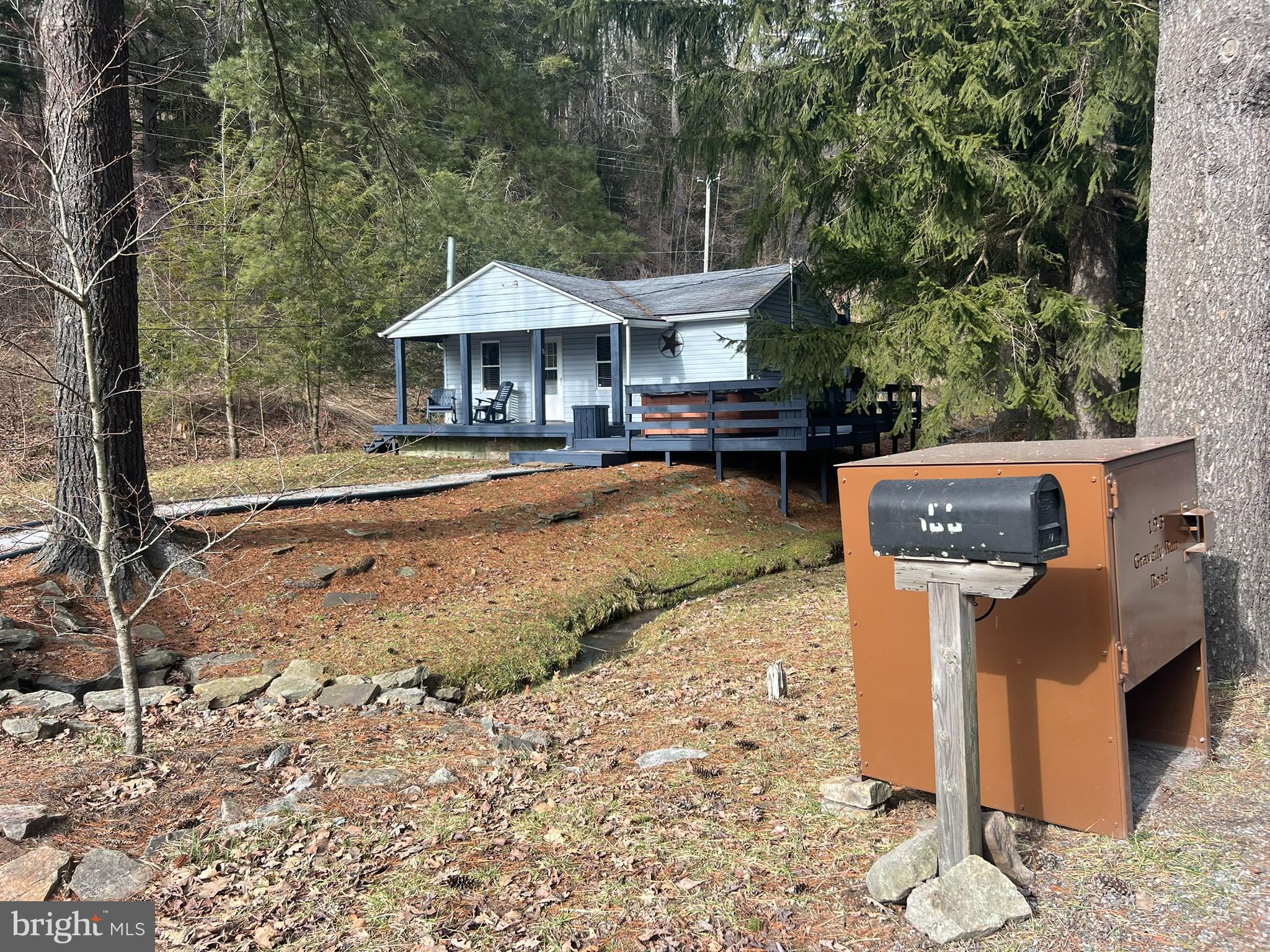 193 Gravelly Run Road McHenry, MD 21541 - Photo 2 of 57 a front view of a house with garden