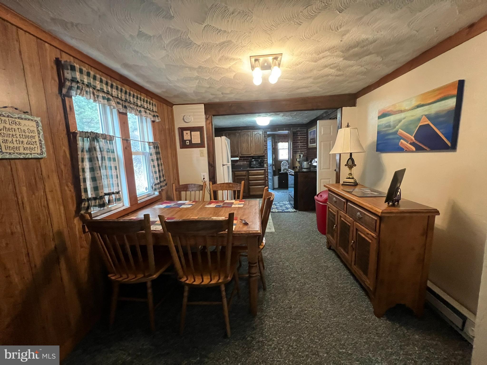 193 Gravelly Run Road McHenry, MD 21541 - Photo 22 of 57 a view of a dining room with furniture window and wooden floor